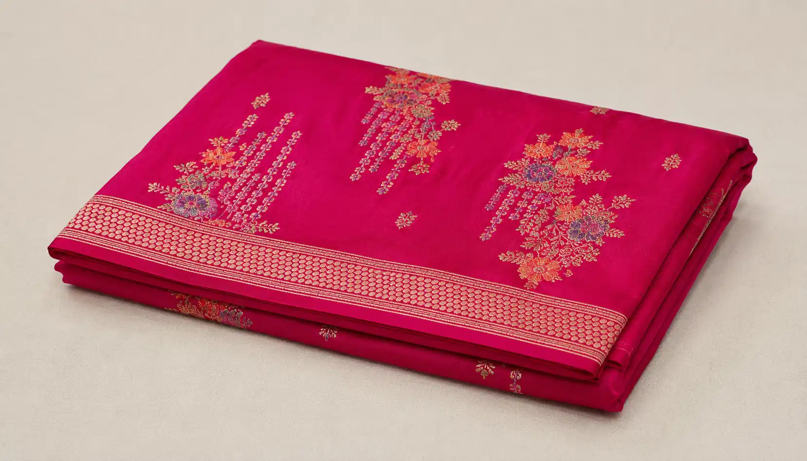 Folded pink Katan silk Banarasi saree with Kadwa floral boota and woven border