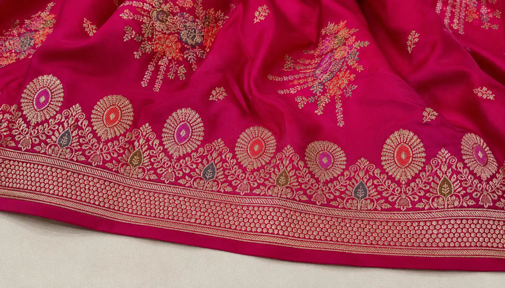 Katan silk Banarasi saree border close-up with woven floral and zari details